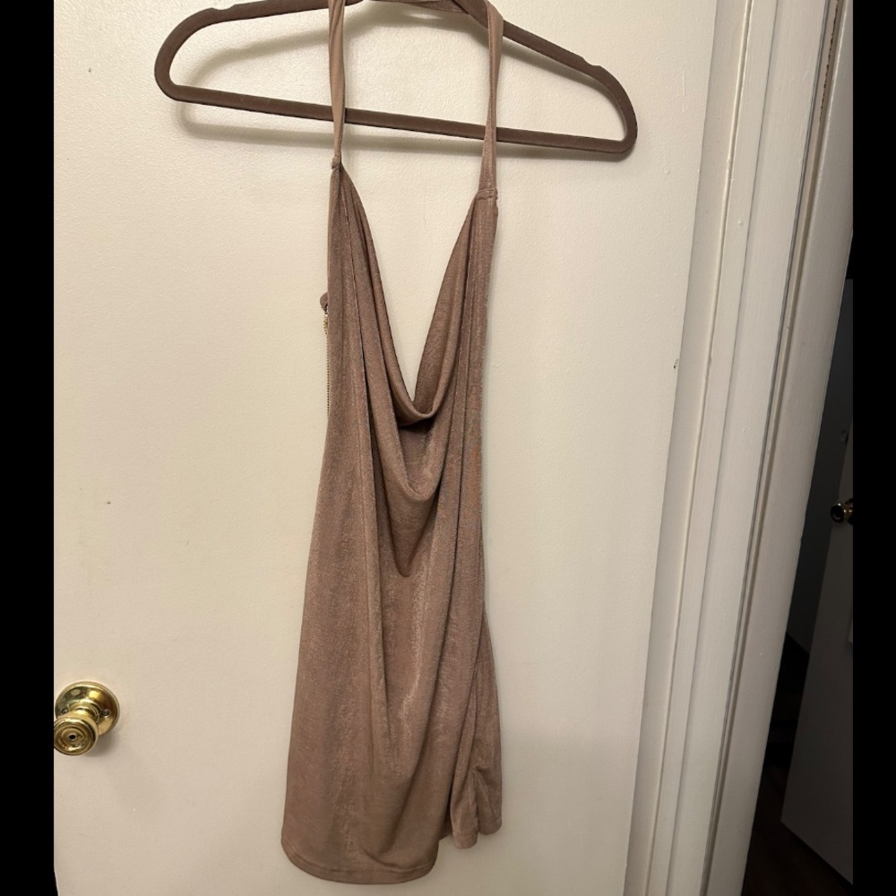 Mini dress. Slouchy front and back. Gold chain on back. Small. Never worn.
